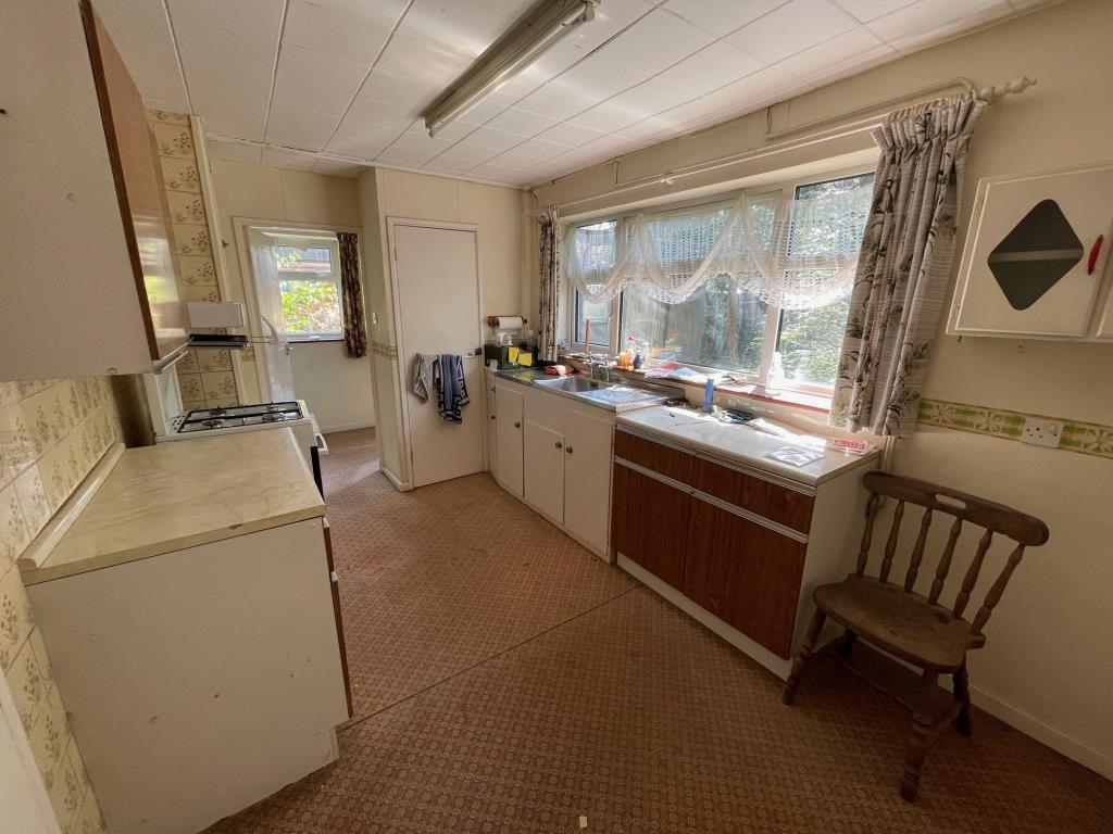Lot: 11 - SEMI-DETACHED HOUSE FOR IMPROVEMENT AND REPAIR - Kitchen with window to the rear